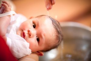 Baby getting baptized